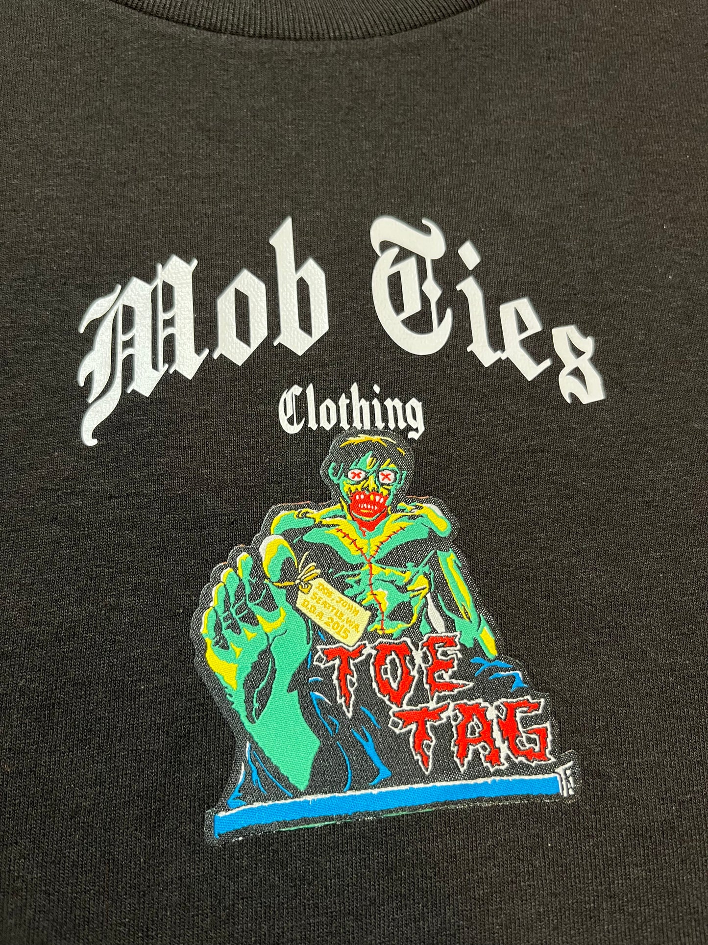 “TOE TAG” PATCH TEE (M)